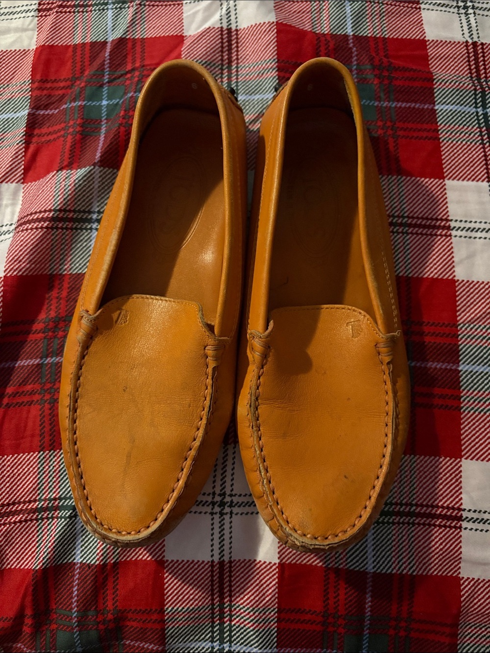These are Tod's Gommino yellow leather driving loafers.